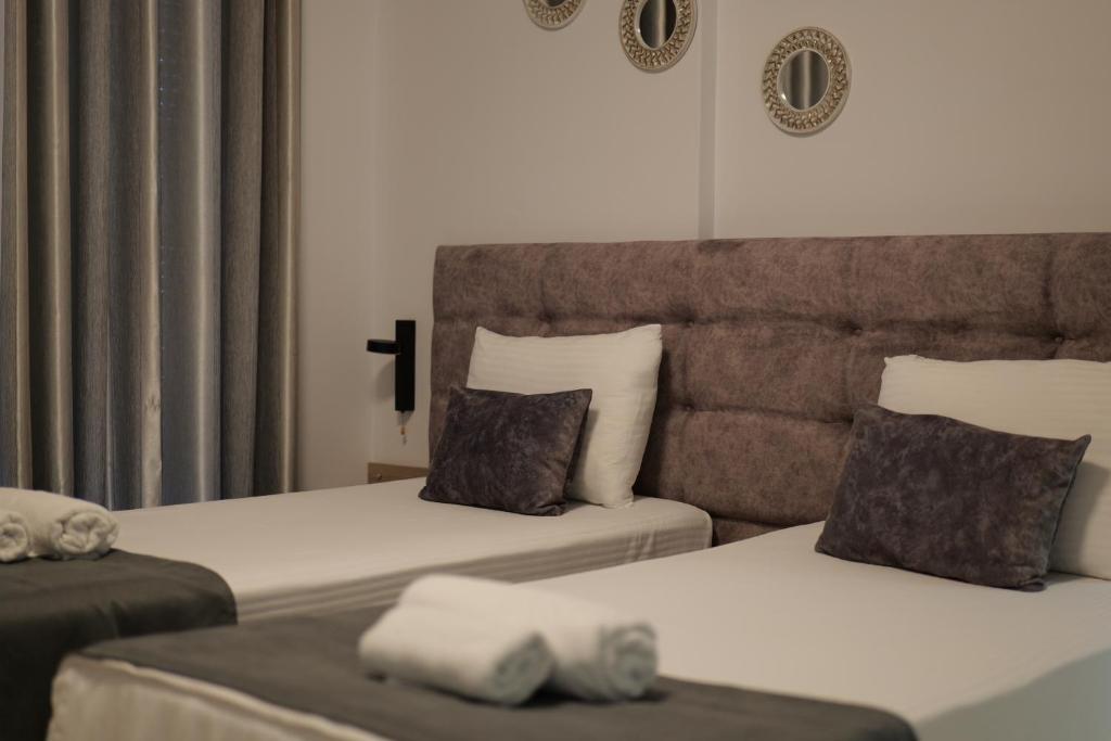 Postel nebo postele na pokoji v ubytování Hotel Abedini