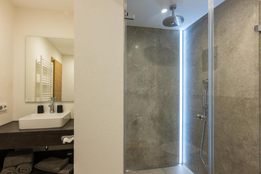 Koupelna v ubytování Dreimäderlhaus - Das vegetarische Boutique Hotel