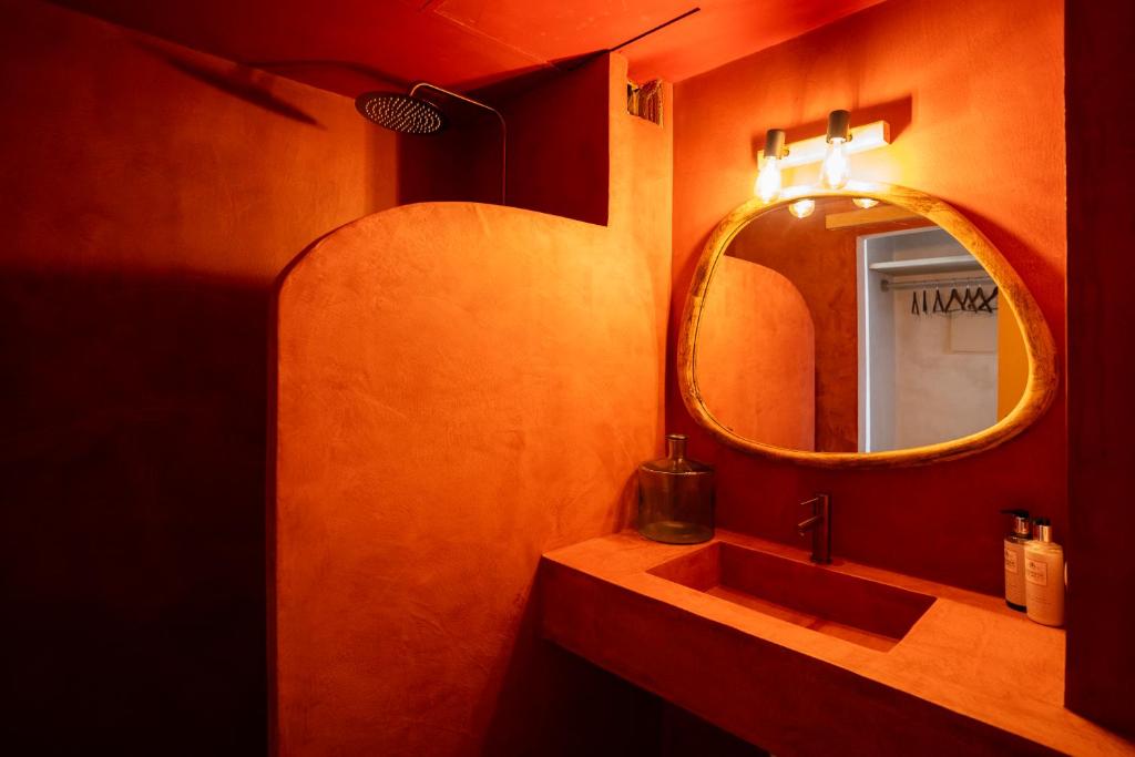 a bathroom with a sink and a mirror at Formentera Especial in La Savina