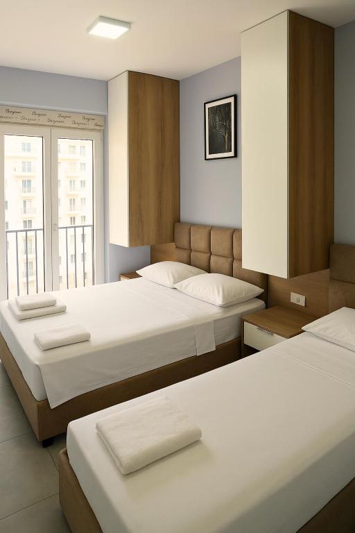 Postel nebo postele na pokoji v ubytování AMMEN Apartment