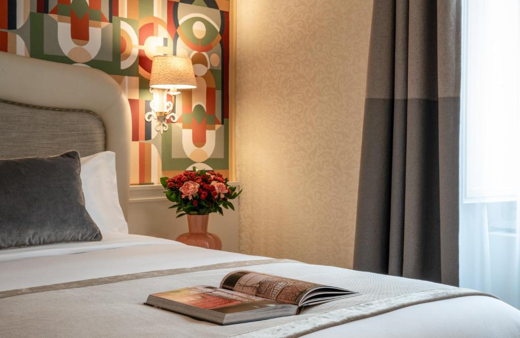 Postel nebo postele na pokoji v ubytování Leonardo Boutique Hotel Rome Monti
