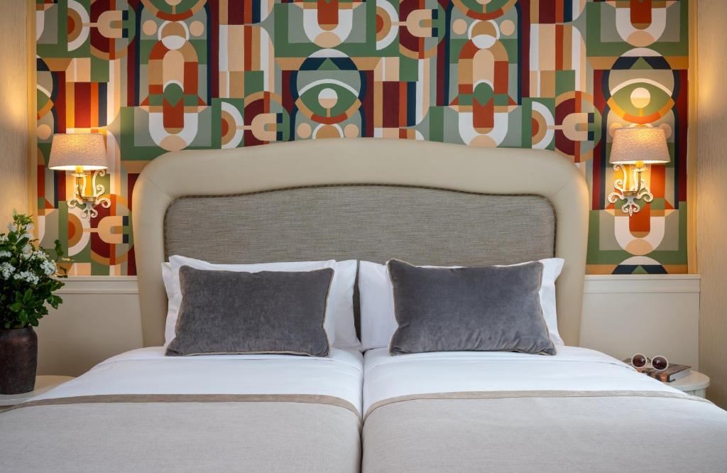 Postel nebo postele na pokoji v ubytování Leonardo Boutique Hotel Rome Monti