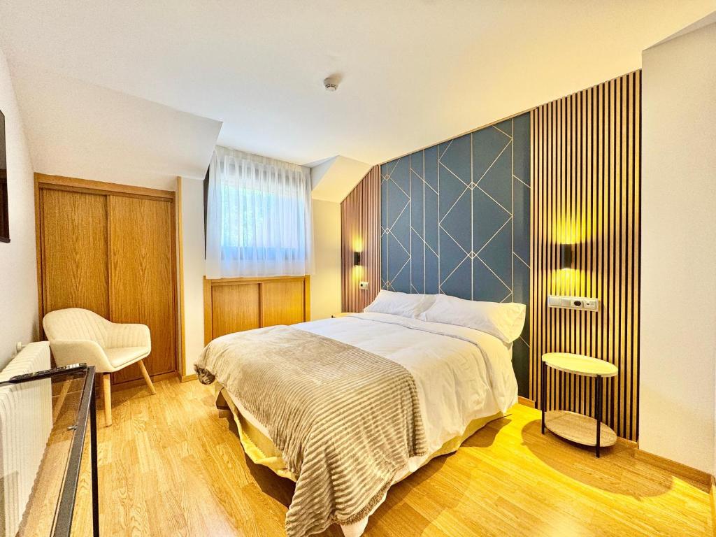 Postel nebo postele na pokoji v ubytování Hotel Ávila Diró