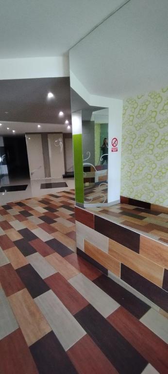 a hotel lobby with a check in counter and a room at Piso Altos de Foz in Foz