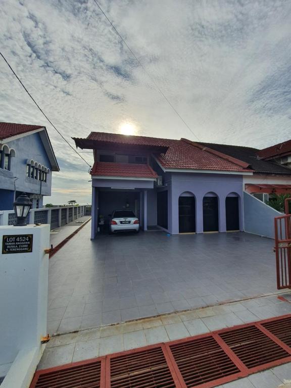a car parked in the garage of a house at Nuri Homestay Rusila 2 in Kuala Terengganu