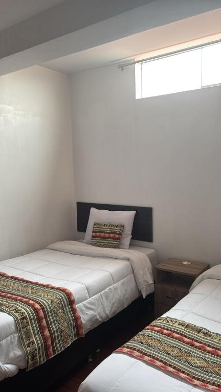 Postel nebo postele na pokoji v ubytování Alegria s House Cusco