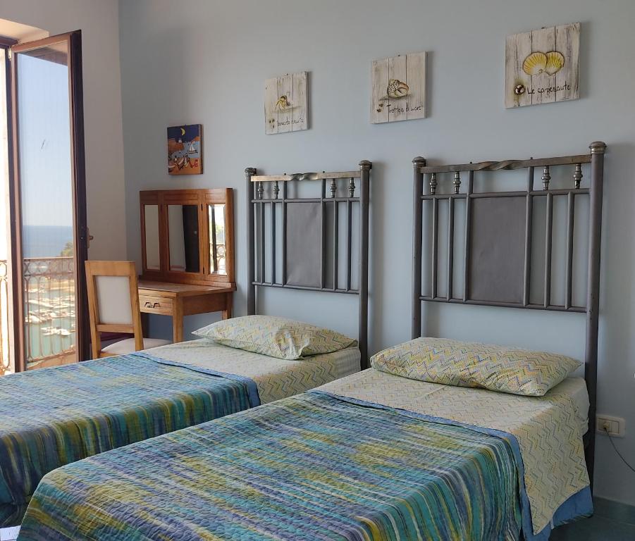 Posteľ alebo postele v izbe v ubytovaní Seaview apartments Stella Maris Agropoli