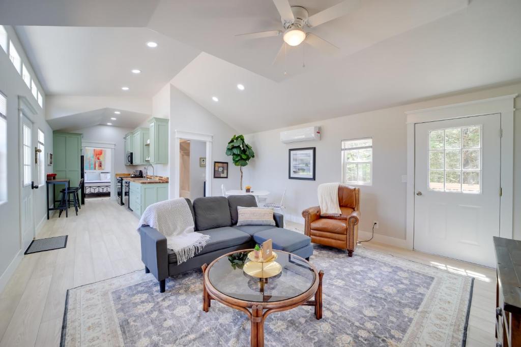 a living room with a couch and a table at Hike, Fish and Explore Cabin Near Eufala Lake! in Crowder