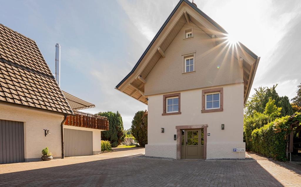 a large white house with a large roof at Ferienhaus Pflugwirts in Oberkirch