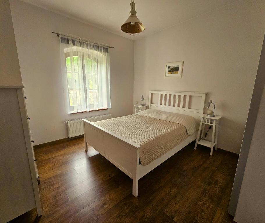 Postel nebo postele na pokoji v ubytování Gospodarstwo nad jeziorem