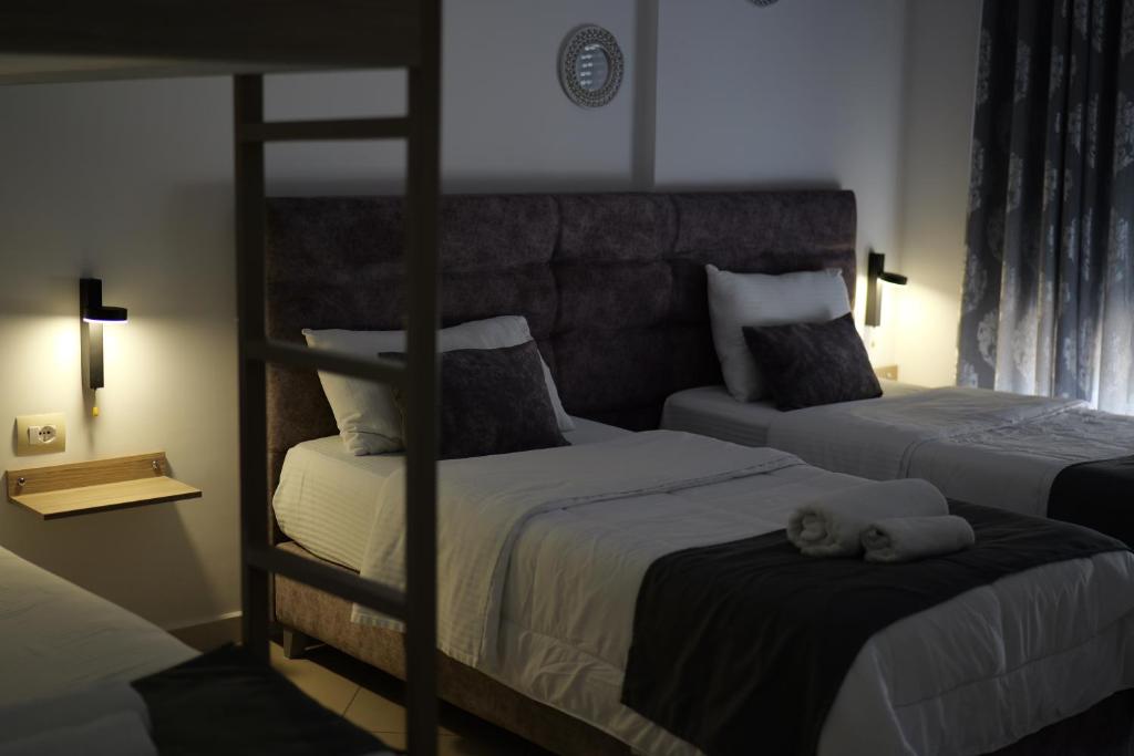 Postel nebo postele na pokoji v ubytování Hotel Abedini