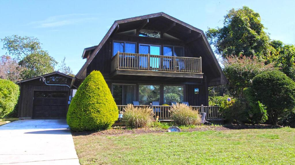 a large house with a gambrel roof at Lily Pad Lake Views in Cape May Point