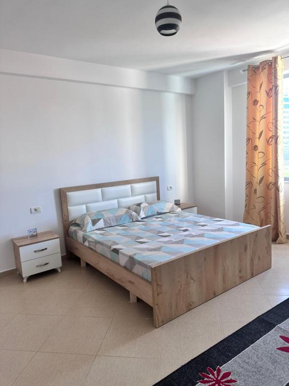Postel nebo postele na pokoji v ubytování Arena Apartment Elbasan