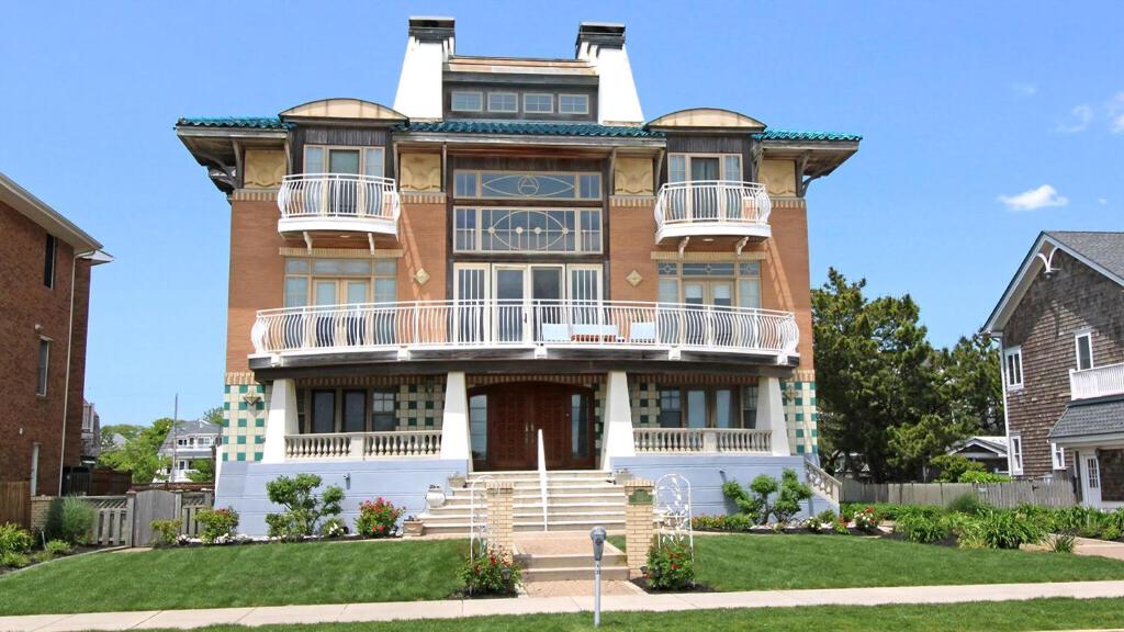 a large brick house with a balcony on the front at 1217 Beach -Villa Antinori in Cape May
