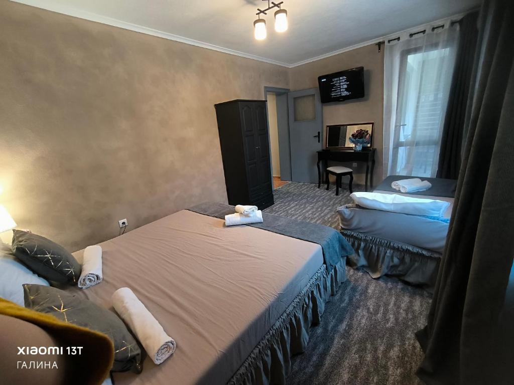 Postel nebo postele na pokoji v ubytování Rali Apartments