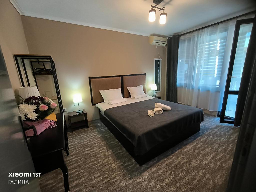 Postel nebo postele na pokoji v ubytování Rali Apartments