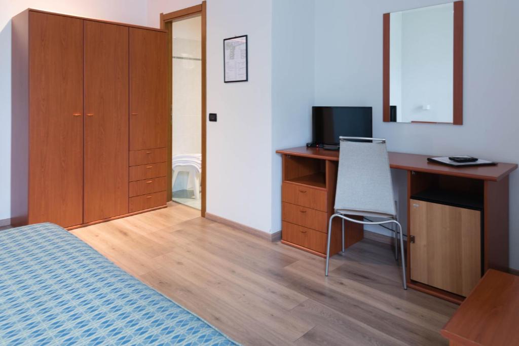 TV a/nebo společenská místnost v ubytování Albergo Ristorante Orazio