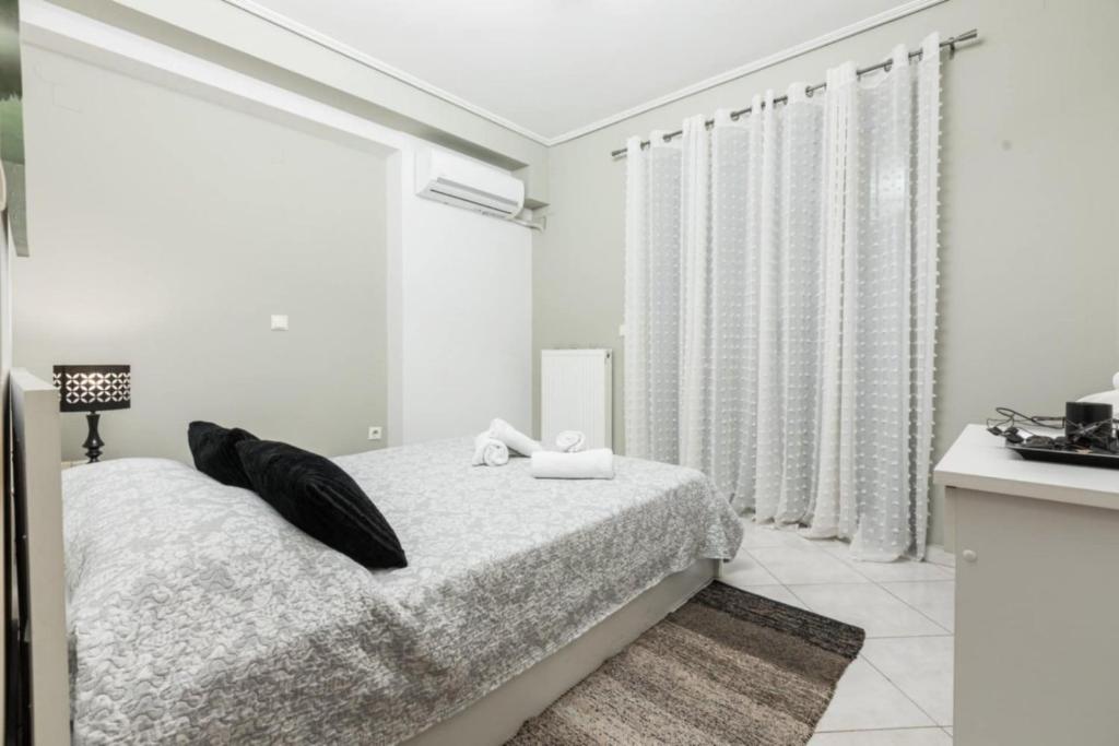 Posteľ alebo postele v izbe v ubytovaní Sparta View Apartments Anais Boutique A1