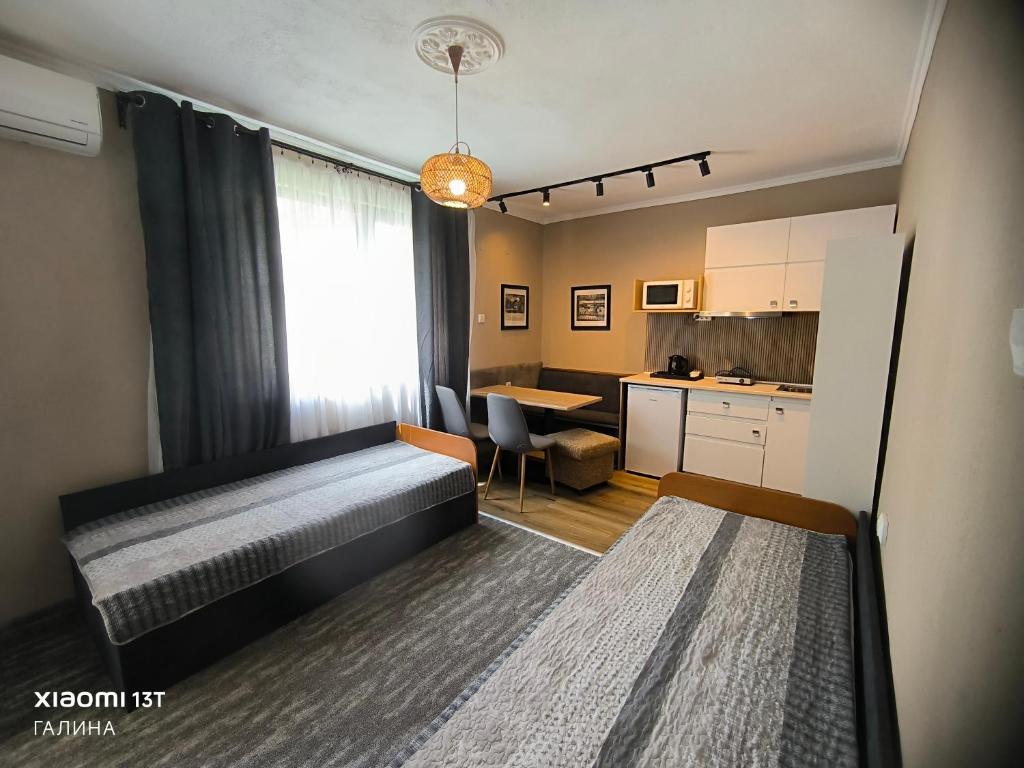 Postel nebo postele na pokoji v ubytování Rali Apartments