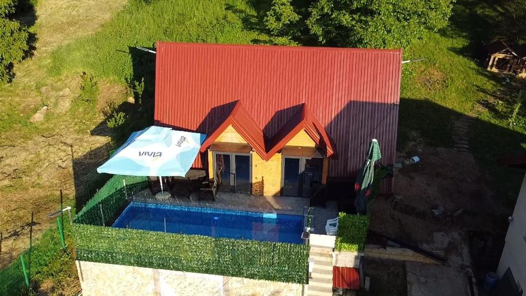 an overhead view of a house with a swimming pool at AM Pyramid resting in Visoko