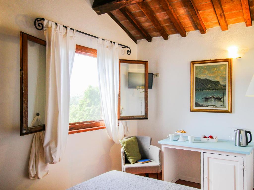 Postel nebo postele na pokoji v ubytování Agriturismo Boschi di Montecalvi