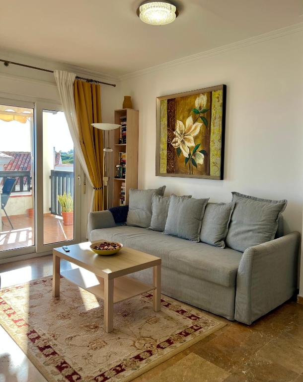A seating area at Beachfront Penthouse Apartment with Large Terrace and Breathtaking Sea Views close to Marbella Spain