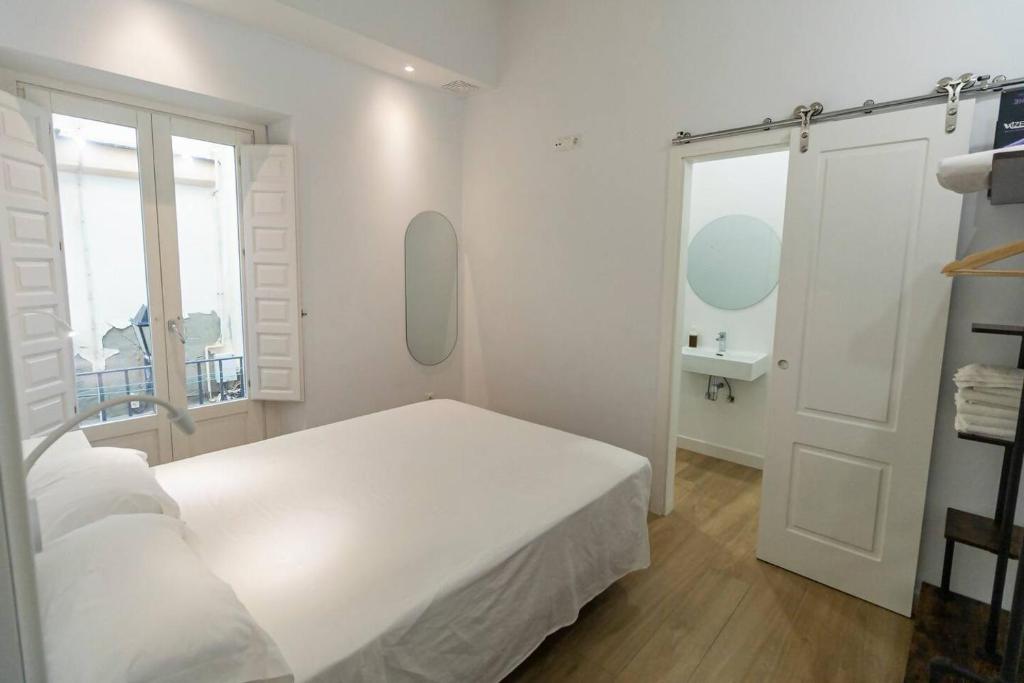 Postel nebo postele na pokoji v ubytování Apartamentos La Cruz Verde