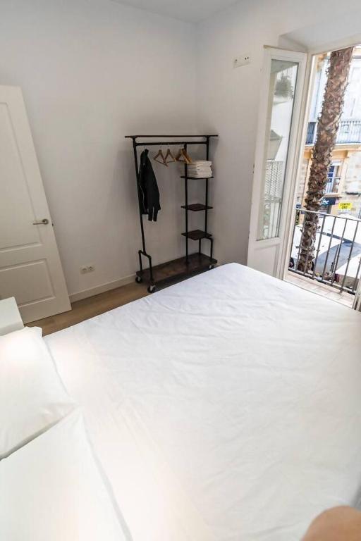 Postel nebo postele na pokoji v ubytování Apartamentos La Cruz Verde
