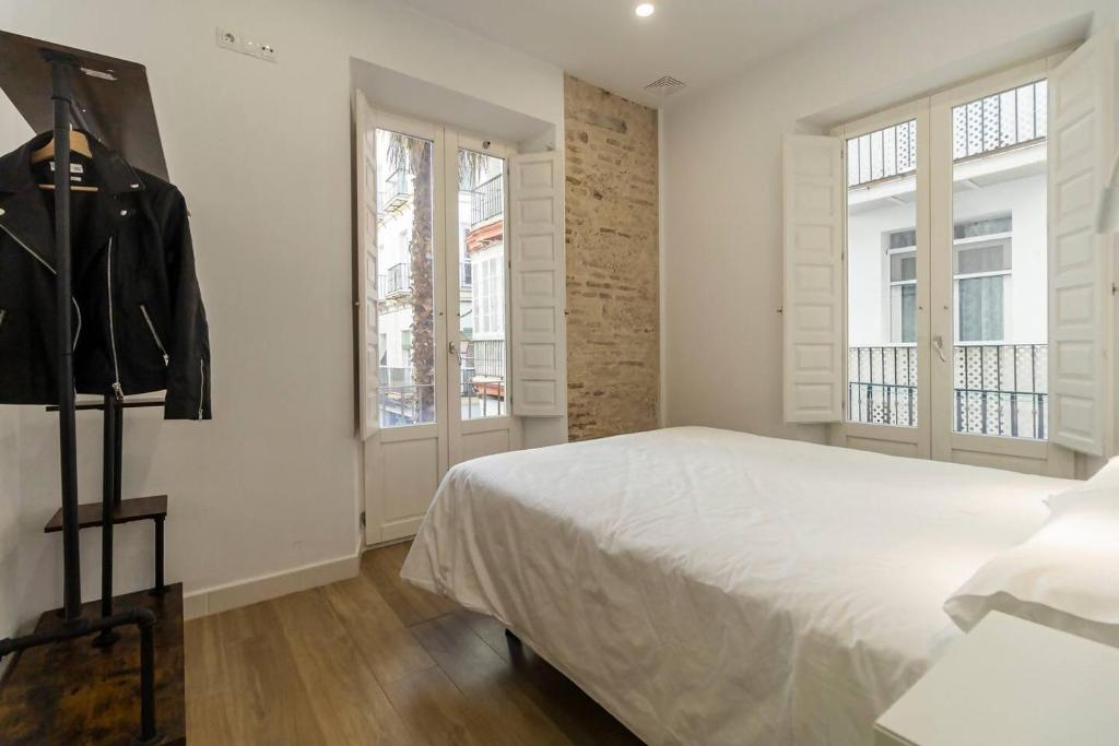 Postel nebo postele na pokoji v ubytování Apartamentos La Cruz Verde