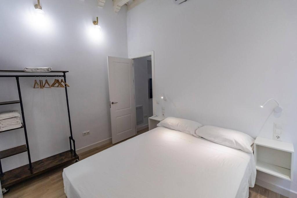 Postel nebo postele na pokoji v ubytování Apartamentos La Cruz Verde