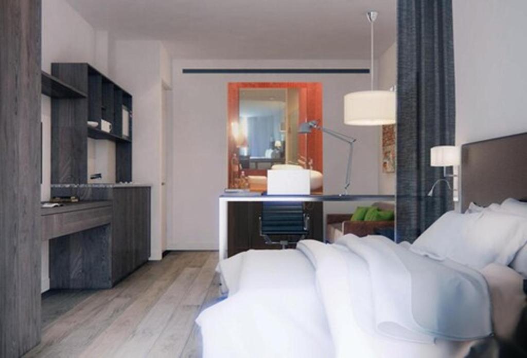 Postel nebo postele na pokoji v ubytování Stain Loft & Suites