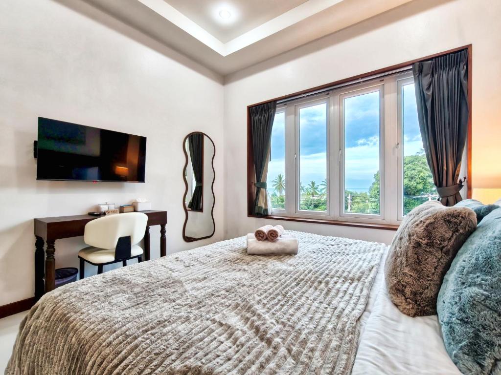 Postel nebo postele na pokoji v ubytování Surisa Seaview Pool Villas