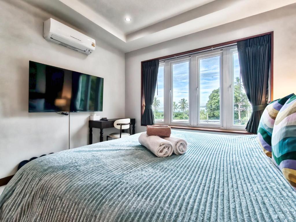 Postel nebo postele na pokoji v ubytování Surisa Seaview Pool Villas