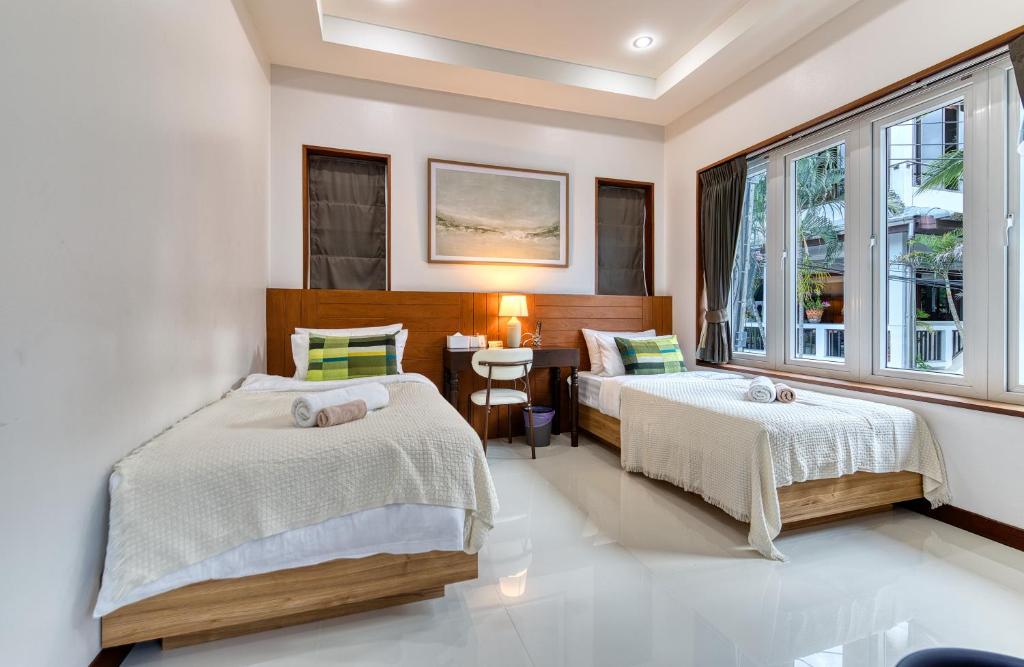 Postel nebo postele na pokoji v ubytování Surisa Seaview Pool Villas