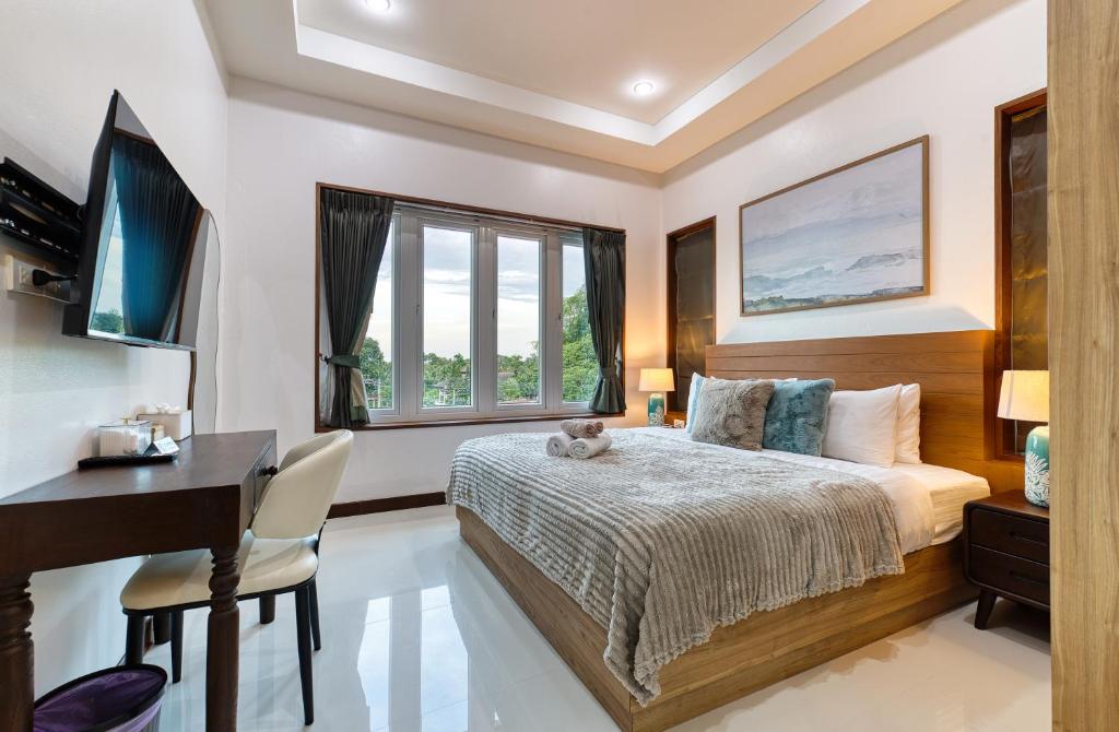 TV a/nebo společenská místnost v ubytování Surisa Seaview Pool Villas