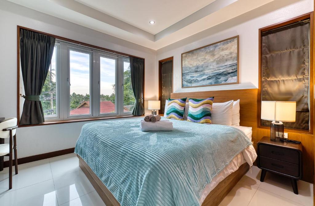 Postel nebo postele na pokoji v ubytování Surisa Seaview Pool Villas