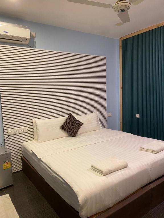 Postel nebo postele na pokoji v ubytování Elysian Hideaway