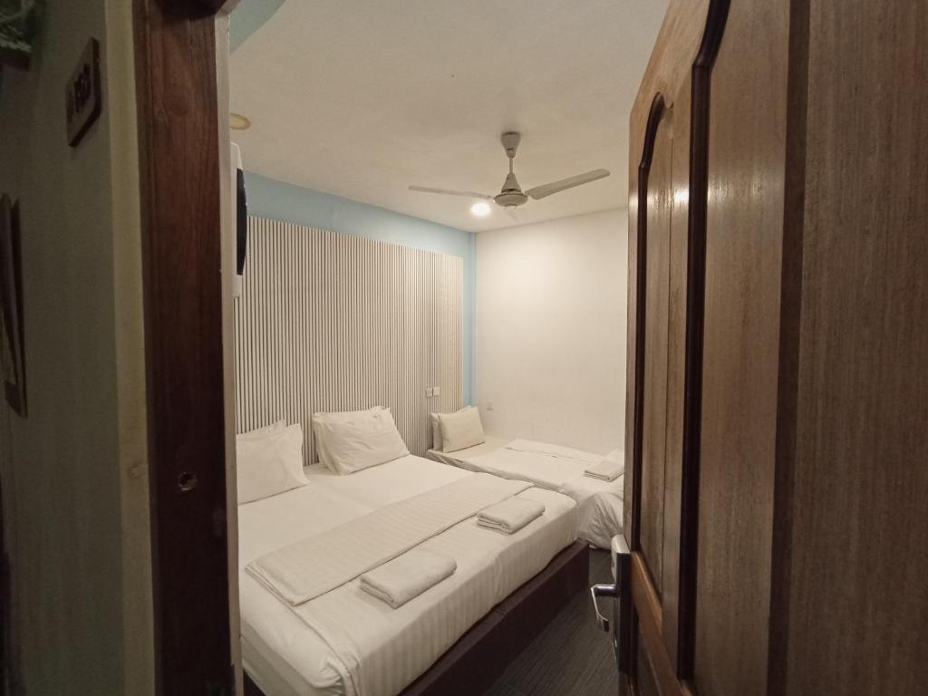 Postel nebo postele na pokoji v ubytování Elysian Hideaway