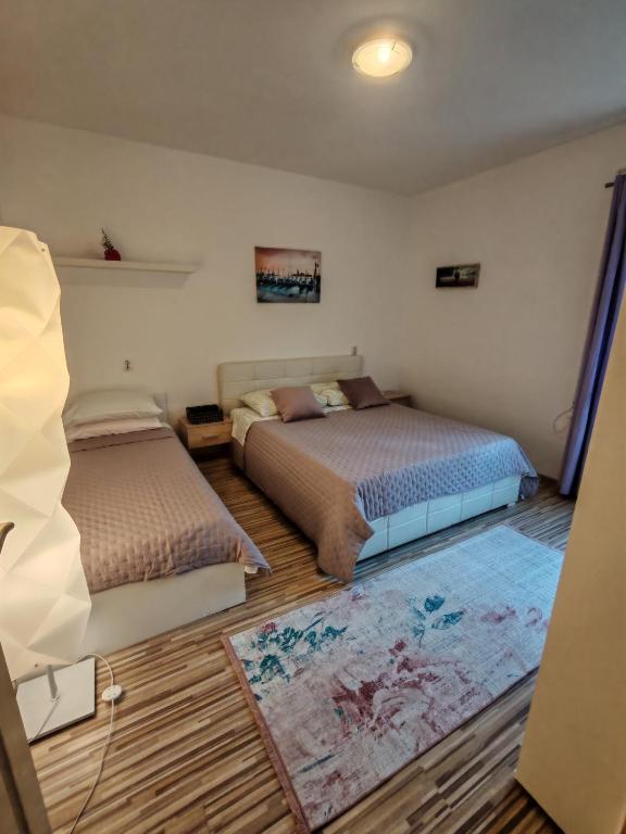Posteľ alebo postele v izbe v ubytovaní Apartment Oscar