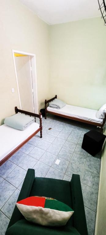 Postel nebo postele na pokoji v ubytování Hostel Kaizen Curitiba