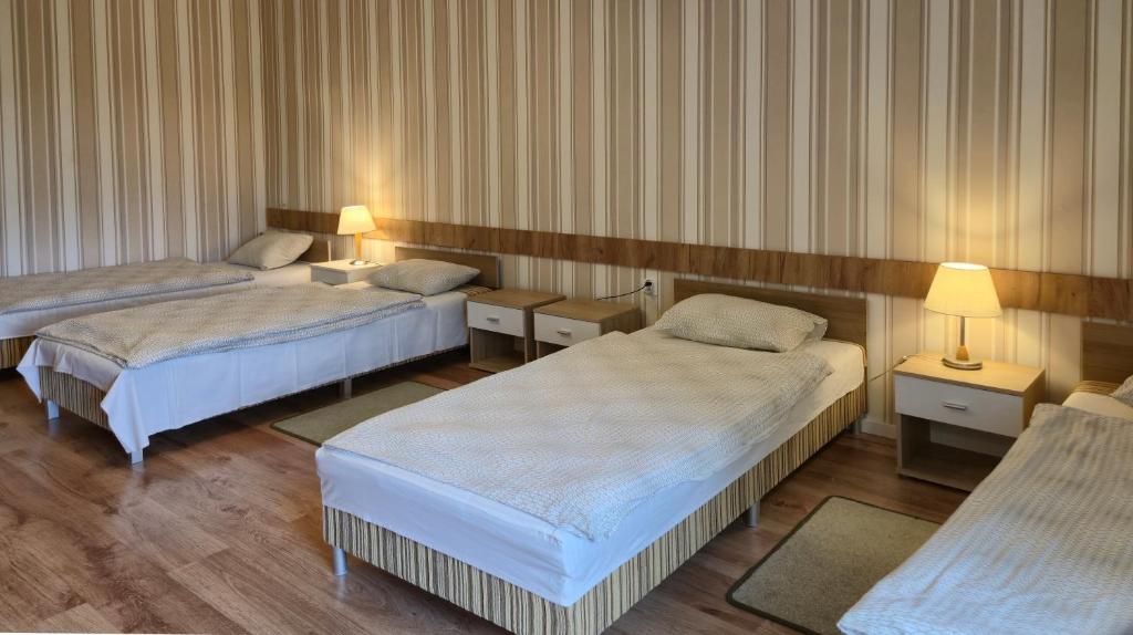 Postel nebo postele na pokoji v ubytování Dom Gościnny BIEGUN