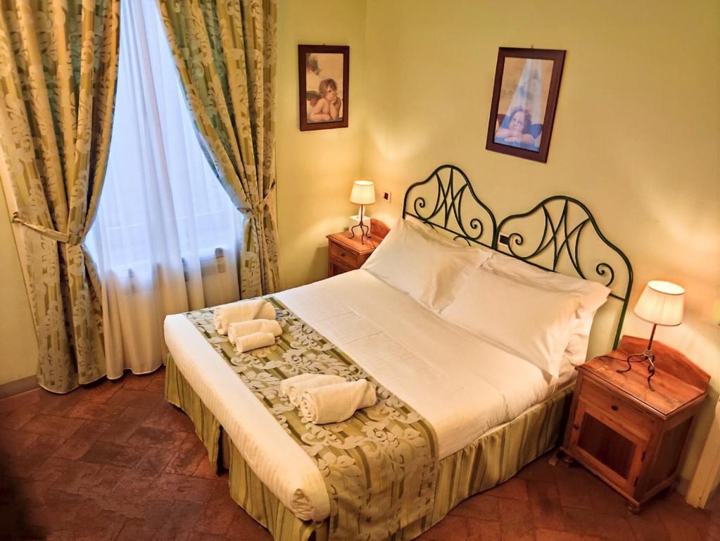 Posteľ alebo postele v izbe v ubytovaní Palazzo Mari
