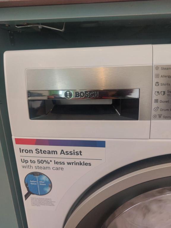a close up of a washing machine with a label at Batumi in Itʼkhvisi