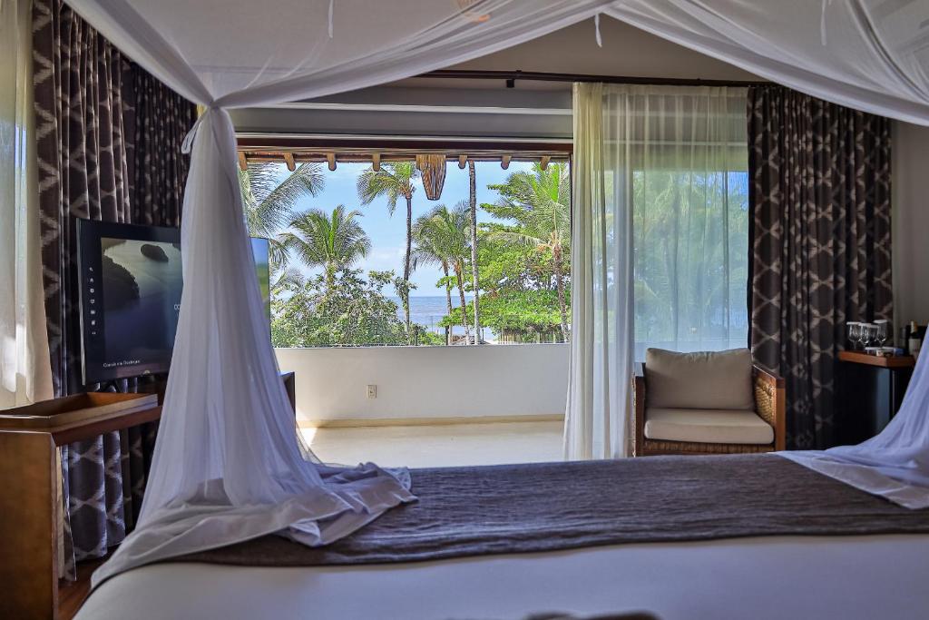 Postel nebo postele na pokoji v ubytování Campo Bahia Hotel Villas Spa