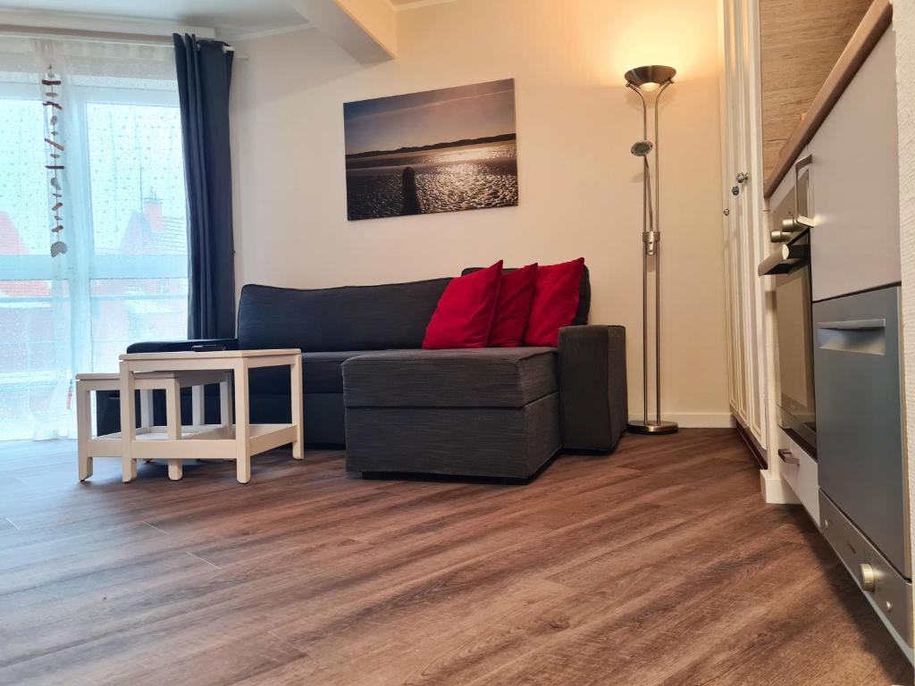 Posezení v ubytování Strandburg Juist Apartment 208 - Schwimmbad und Sauna kostenfrei