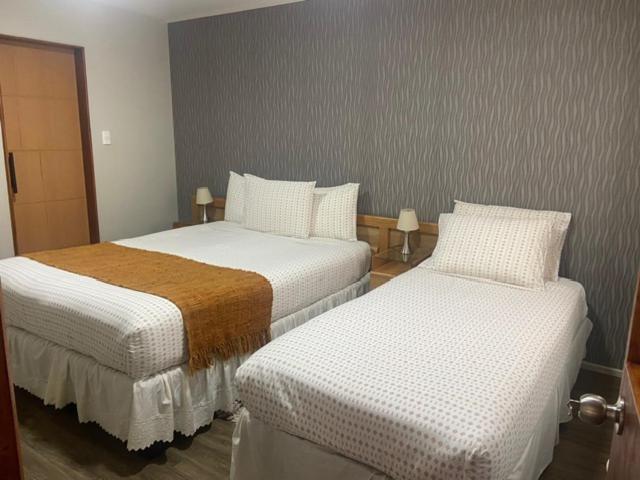 Uma cama ou camas num quarto em Cabañas Bosque Austral