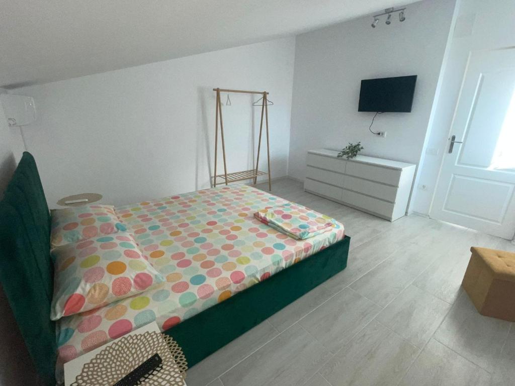 Postel nebo postele na pokoji v ubytování Casa AnaMaria