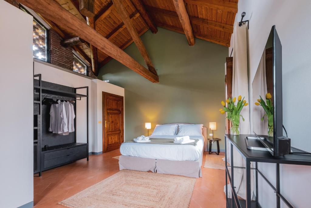 Postel nebo postele na pokoji v ubytování Relais Macconago