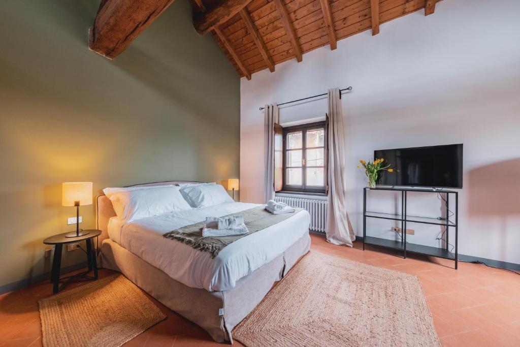 Postel nebo postele na pokoji v ubytování Relais Macconago
