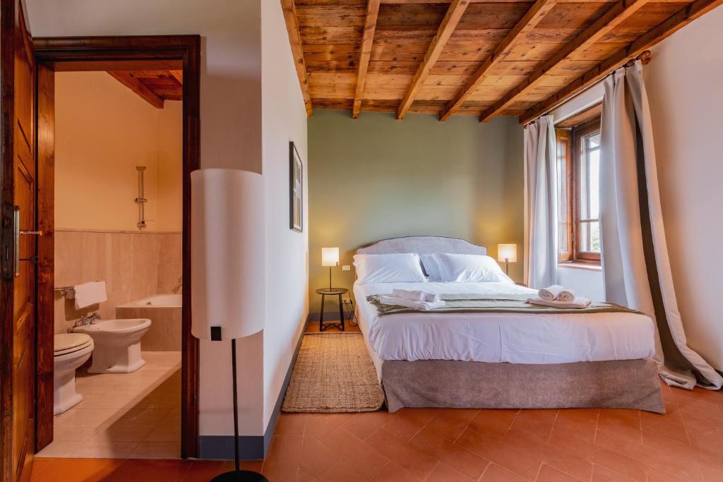 Postel nebo postele na pokoji v ubytování Relais Macconago